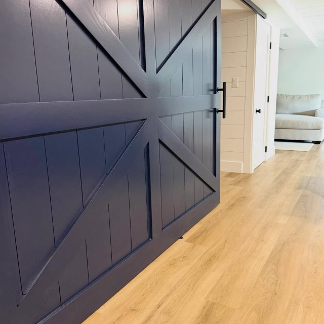 Bold - Functional and built to make a statement.

This custom navy barn door added character, privacy, and architectural interest all in one. From the clean lines to the oversized hardware, every detail was designed to elevate this basement renovation while maximizing usable space.

A perfect example of how custom millwork can transform an ordinary opening into a standout feature ⚓️