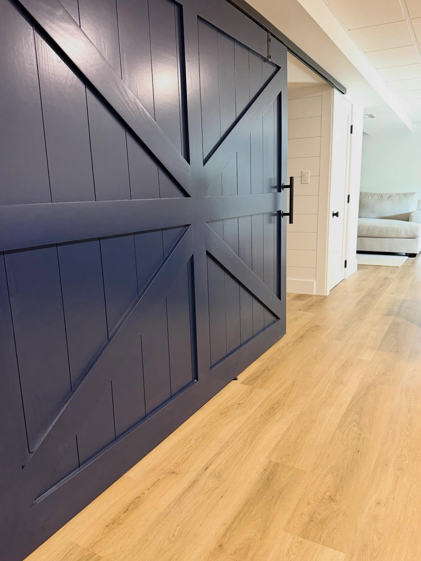 Bold - Functional and built to make a statement.

This custom navy barn door added character, privacy, and architectural interest all in one. From the clean lines to the oversized hardware, every detail was designed to elevate this basement renovation while maximizing usable space.

A perfect example of how custom millwork can transform an ordinary opening into a standout feature ⚓️
